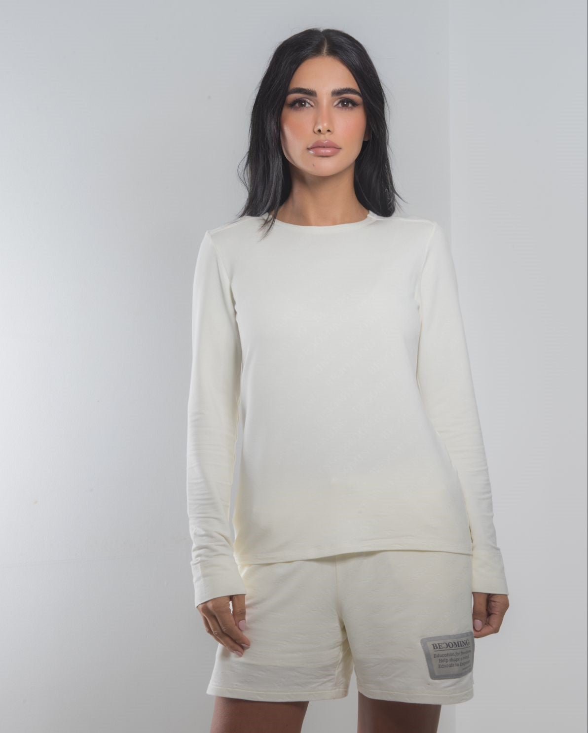 Off White Long Sleeve T Shirt front view showing minimal design and soft cotton texture.